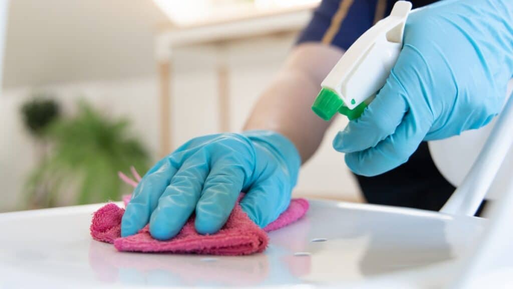 Trusted residential cleaning service wiping down countertops.